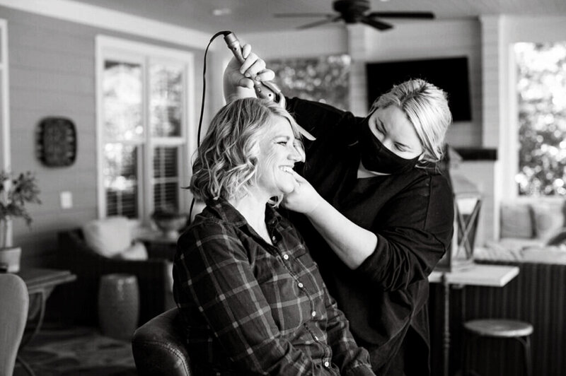 Natasha Sewell having hair curled by Chelsea Regan