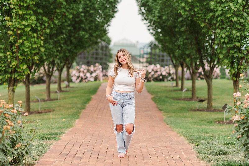 senior girl posing in the middle of brick walkway at hershey gardens by york pa photographer