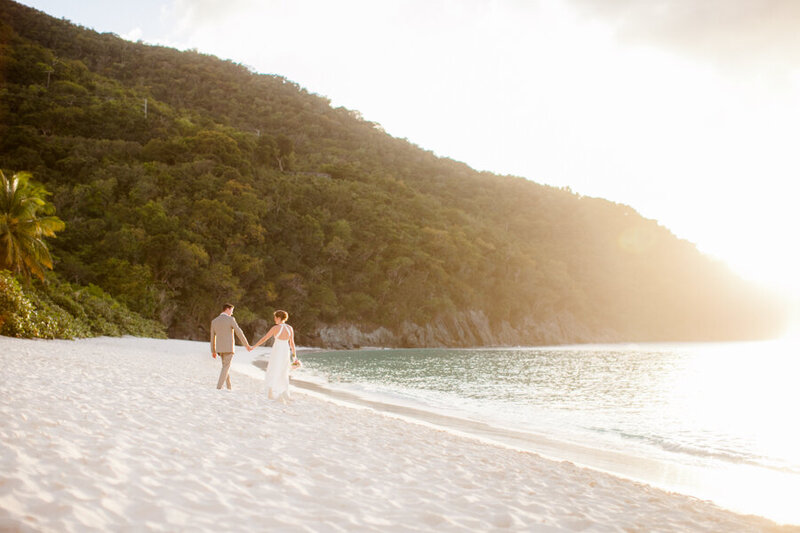 Wedding photograph of bride and groom kissing on Bald Head Island beach