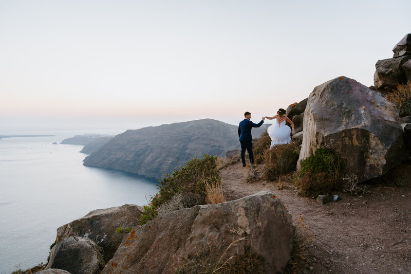 Santorini couple hiking elopement