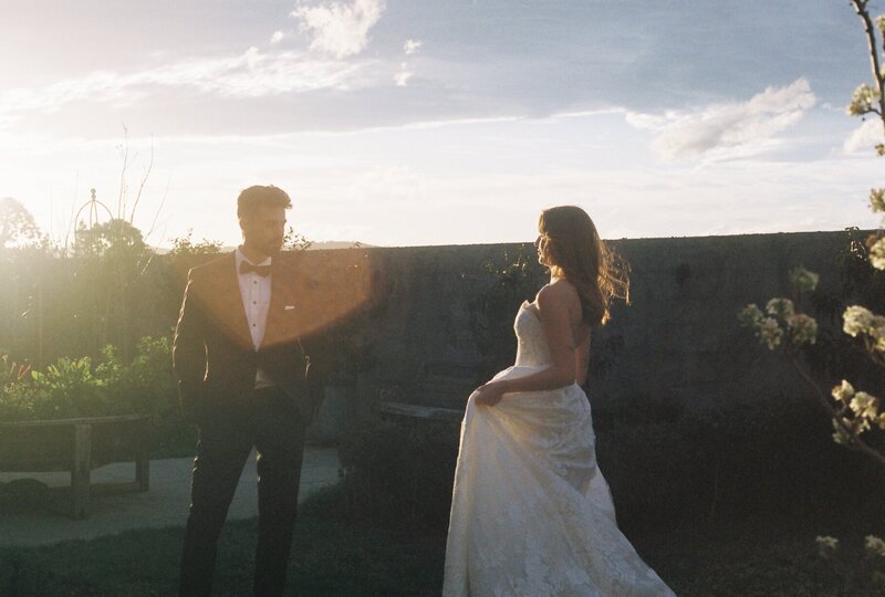 bride and groom kiss at wedding