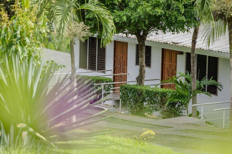 Garden rooms surrounded by tropical plants for yoga instructor course students in Costa Rica