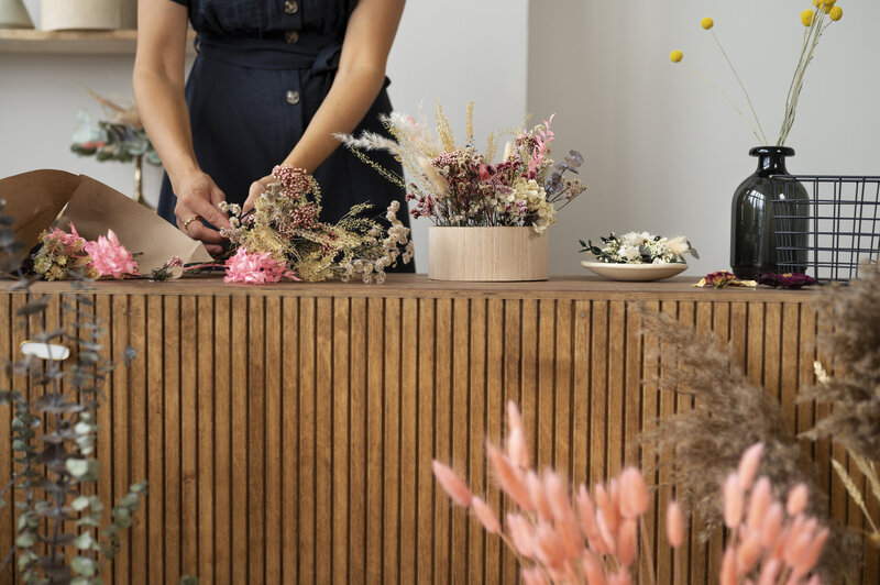 front-view-woman-working-with-flowers