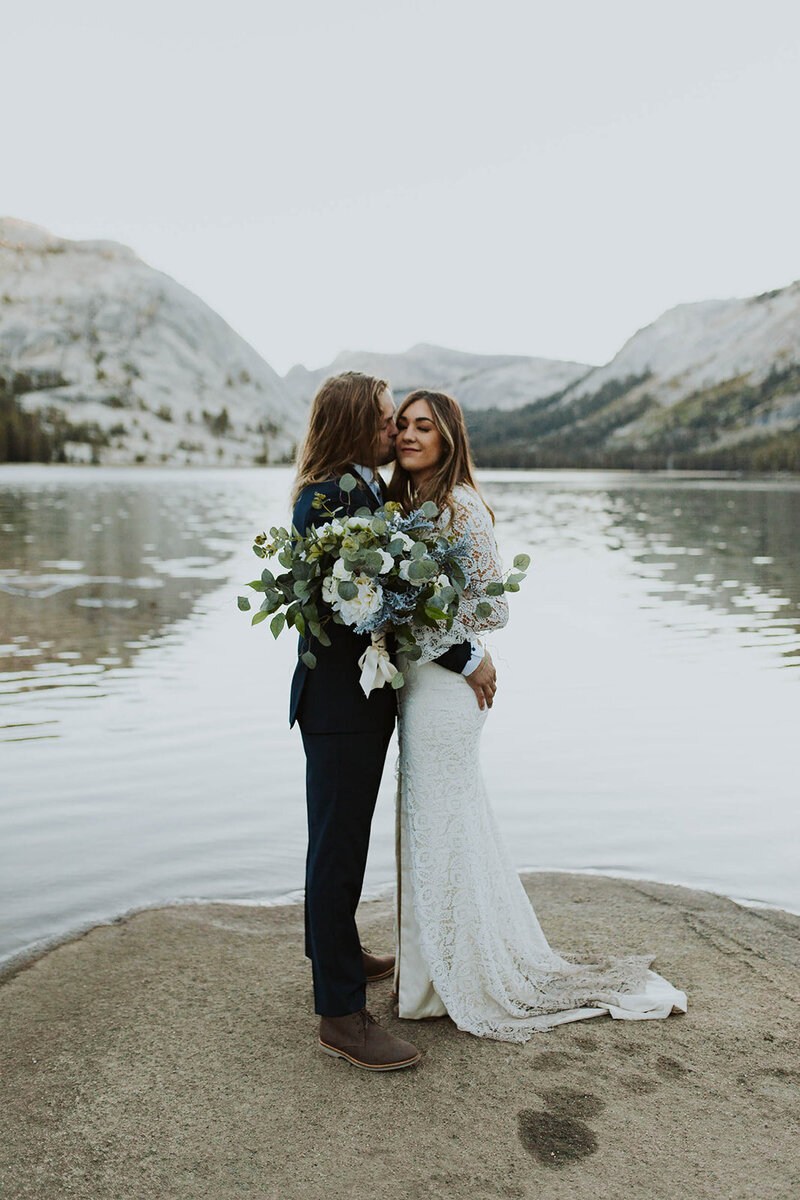 bride and groom getting married at tenaya lake in yosemite
