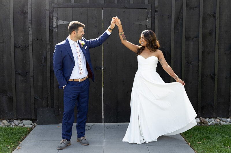 Bride and groom dancing outside of Terrain Gardens at Delval Wedding