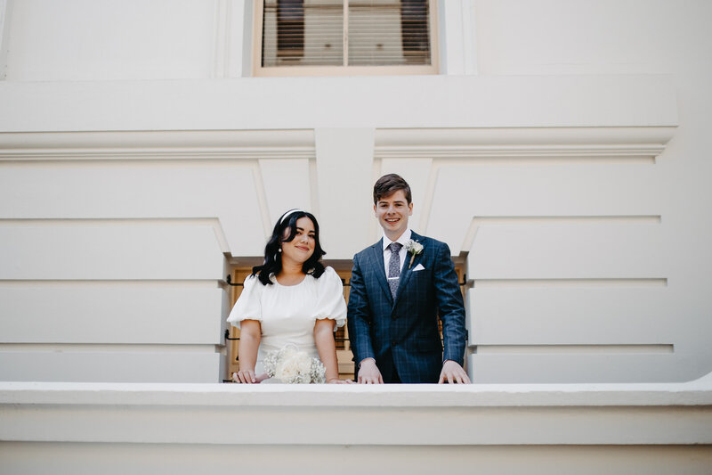 modern bride and groom walking through inner city streets of melbourne