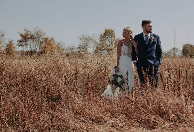 bride and groom in wildflower fields in the country Heath Ohio