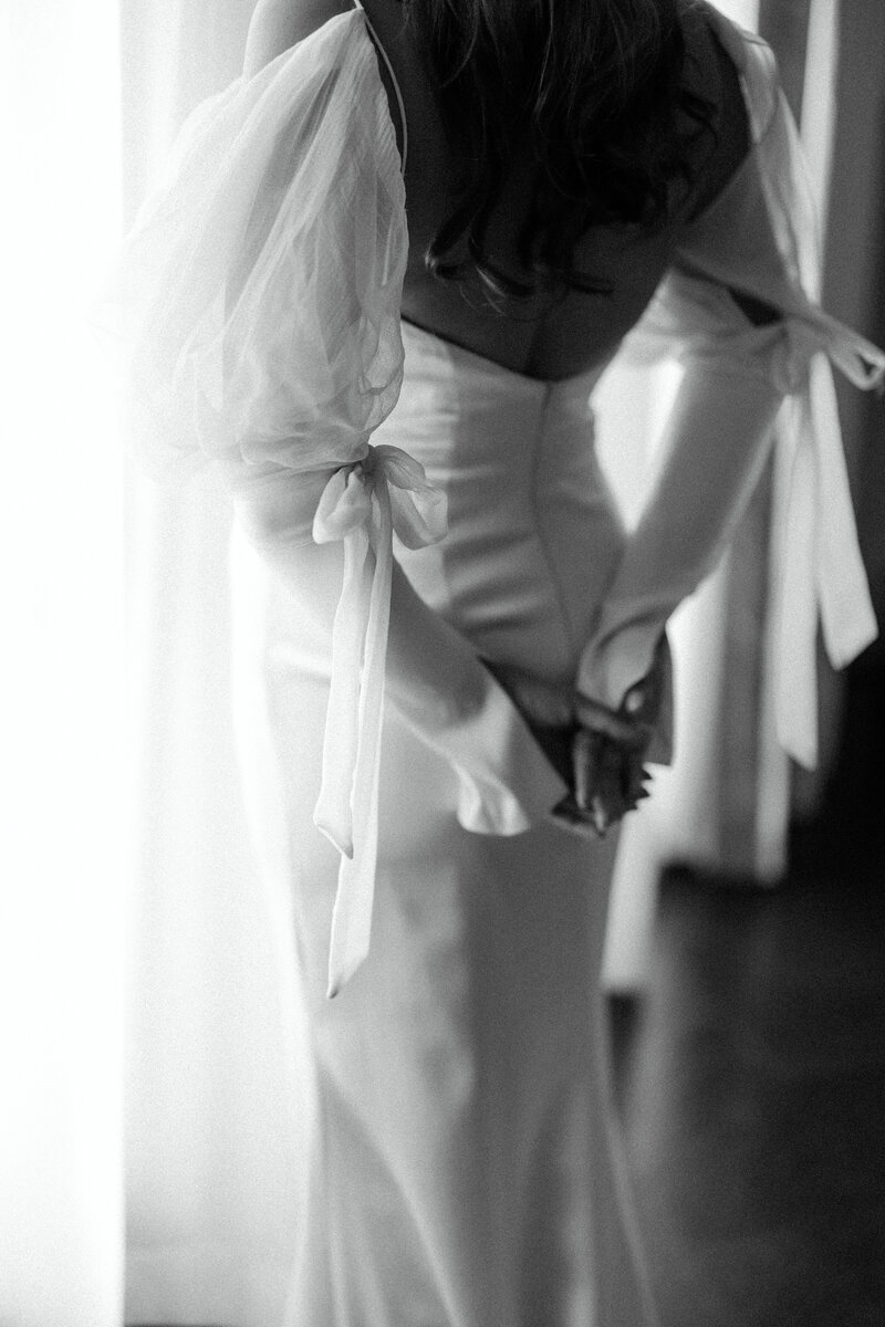 Black and white bridal getting-ready moment at Commodore Perry Estate in Austin, Texas. A timeless fine art wedding photograph capturing delicate details and soft lighting.