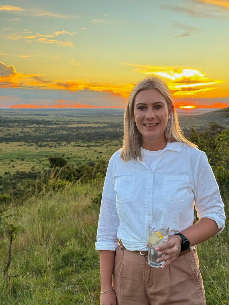 Jenna looking over shoulder viewing out over the Serengeti