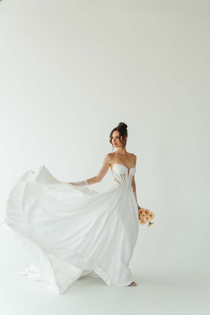bride playing with her dress