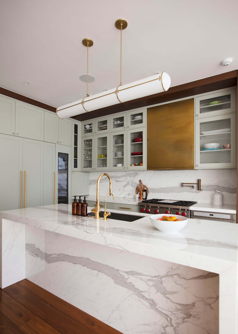 modern kitchen with marble surface and gold accents