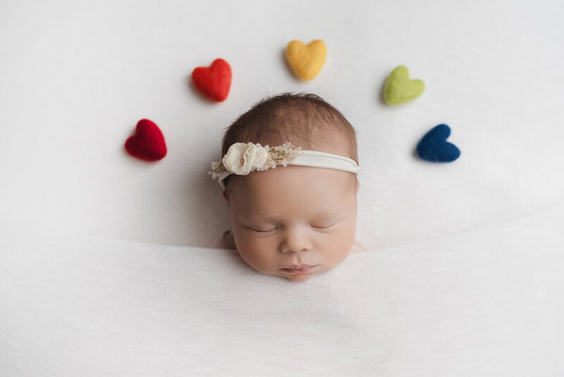 newborn baby rainbow baby with rainbow hearts