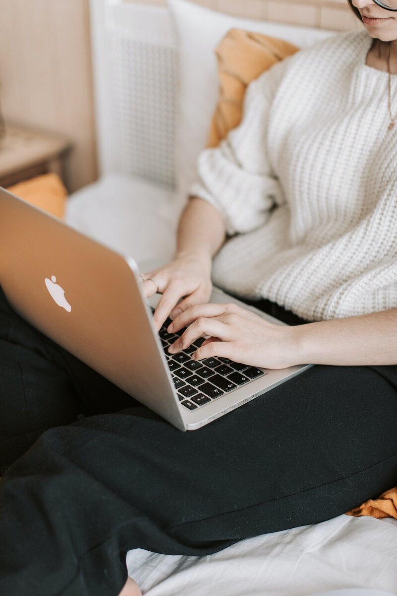 woman typing on laptop