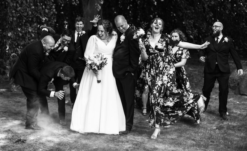 Laughing and dancing wedding party at the Schoolhouse in Fairview, PA
