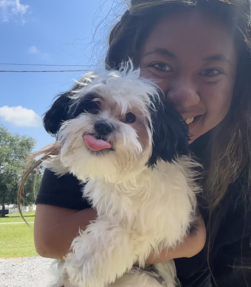 girl holding dog in photo in texas