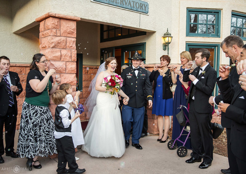 Couple's grand exit from Briarhurst Manor wedding venue in Colorado Springs