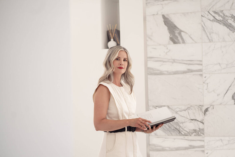 Business woman walking down the stairs