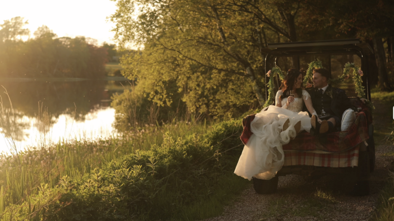 Couple on a buggy during golden hour on their wedding day