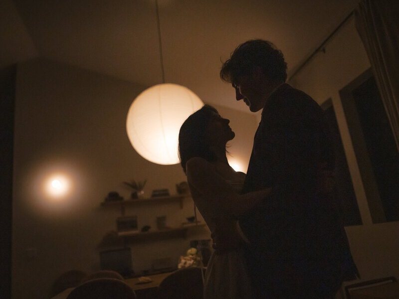 couple sillouhette in front of rice paper lantern