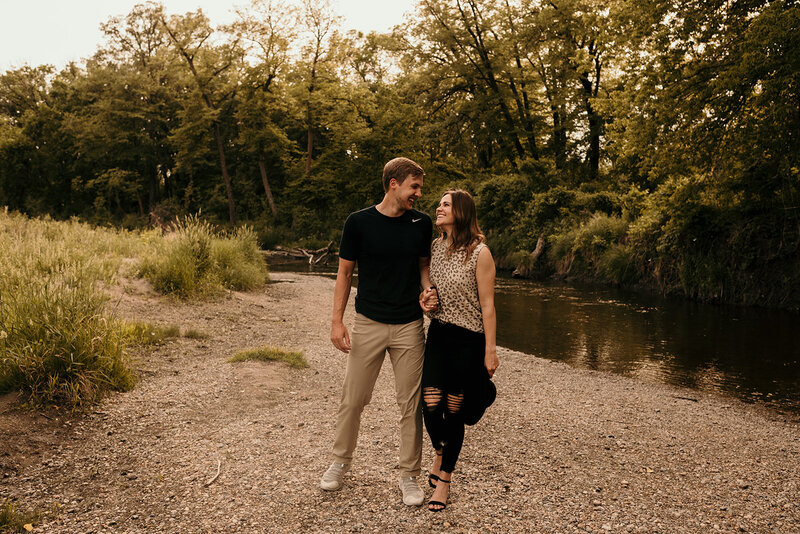 couple frolicking by the river