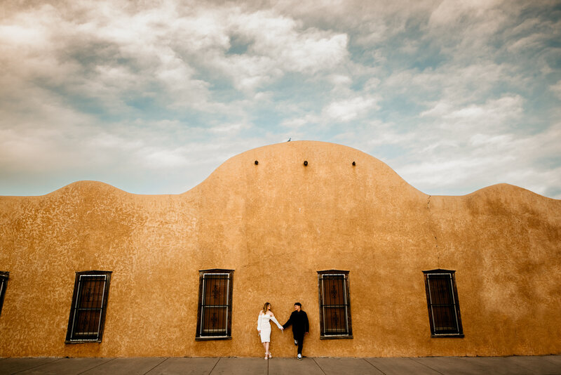 Downtown Square + Hotel Engagement Session with a young couple in love in Northern colorado 