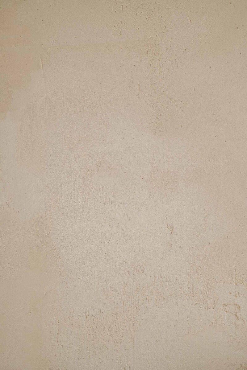 Soft tan wall texture used as a design background on website 