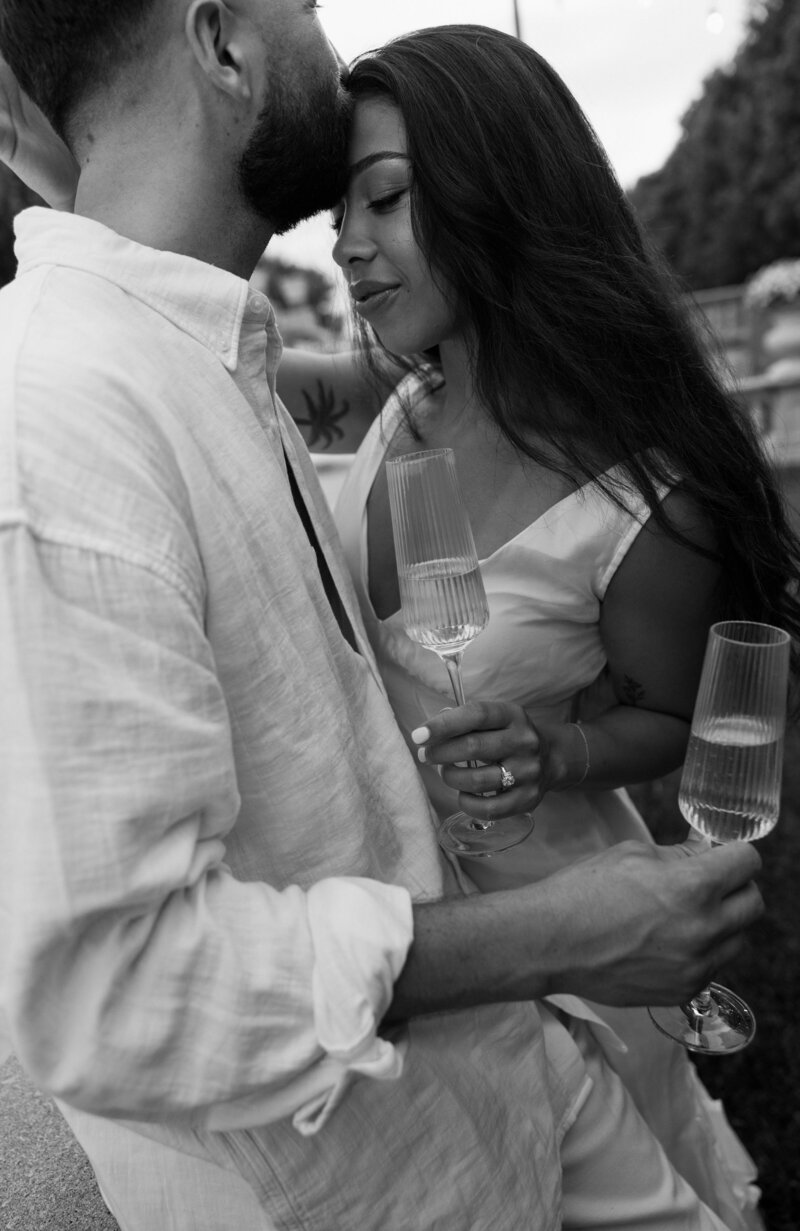 classic film engagement photos for save the date invitations. wine and picnic date and romantic dancing in field is perfect for casual photos