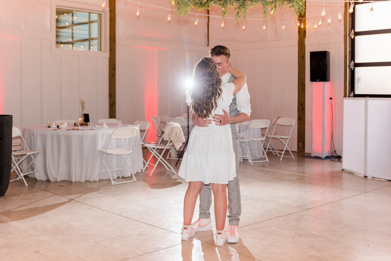 A young couples first dance at their reception.