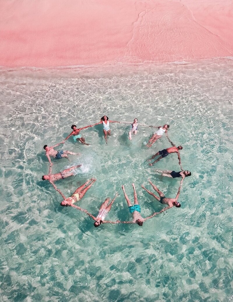 a group of women entrepreneurs at the beach sharing revenue growth tips