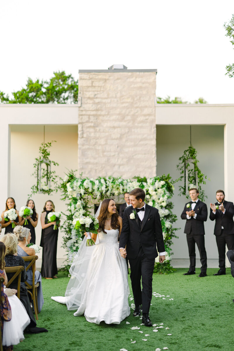 This colorful Mexico destination wedding featured bold tropical florals, emerald green bridesmaid dresses, beachside portraits, and elegant editorial-style wedding photography. Katie & Jonathan's Riviera Maya celebration blended vibrant details with modern romance — perfect inspiration for couples planning a luxury wedding in Mexico.