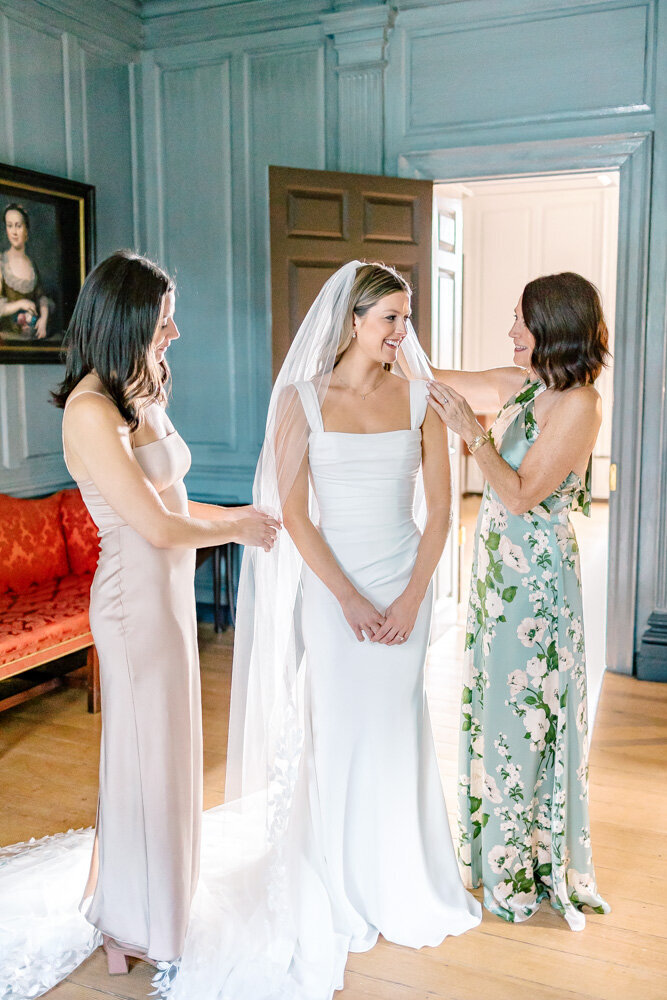 Luxury Wedding Photographer Atlanta | Bride With Mom And Maid Of Honor Fixing Her Veil At Estate Wedding Venue