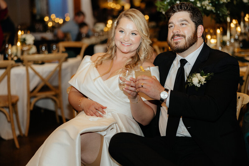 The couple smiling at the camera.