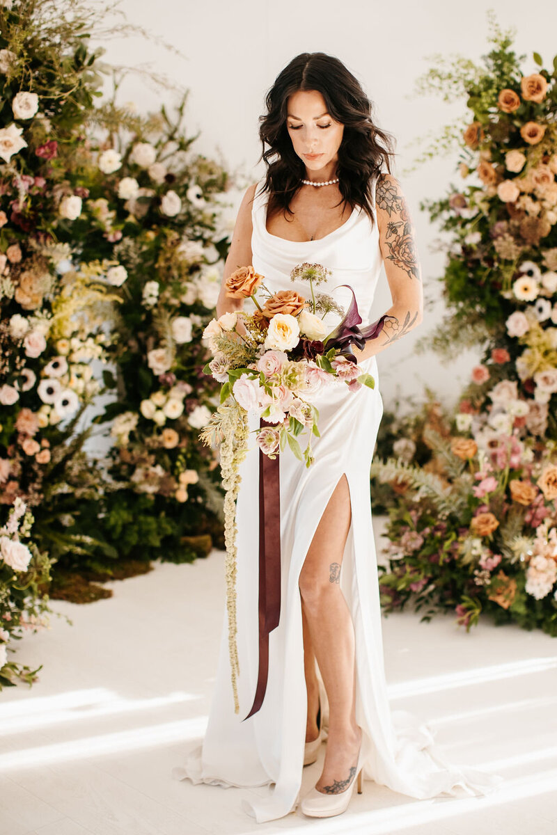 Bride at ceremony altar by Tennessee wedding planners Siena & Co. Events.
