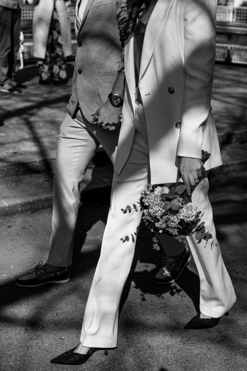 A couple holding hands representing the beautiful artistry of the Crush Collective wedding expo.