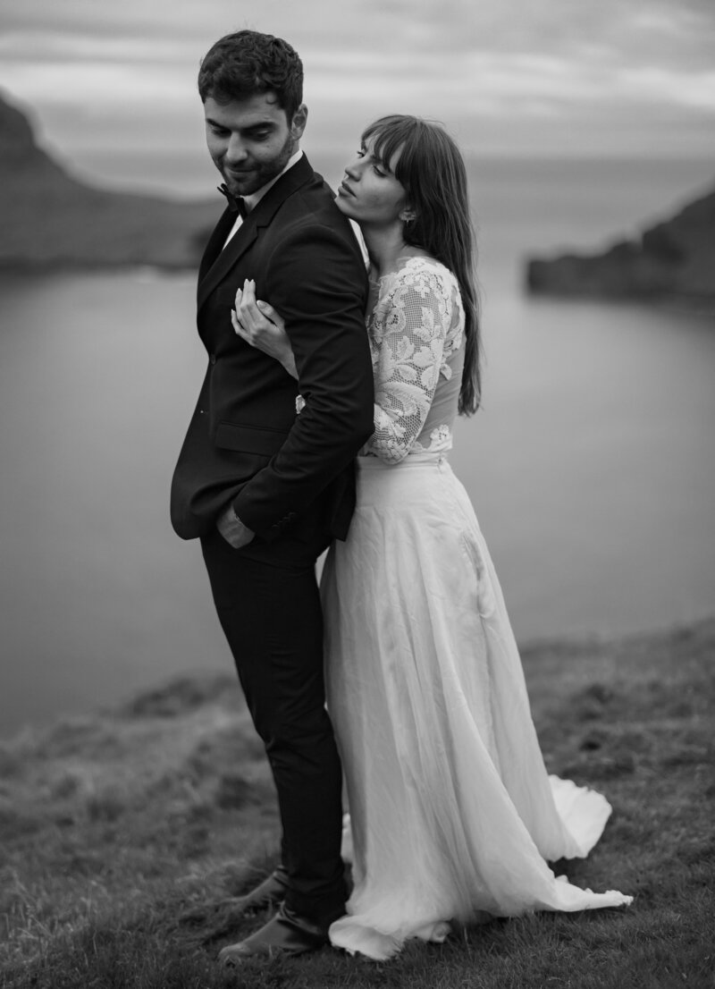 Faroe Islands elopement portraits – bride and groom laughing in the wind, by Kollar Photography.