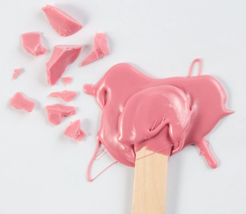 Pink hard wax used for gentle and precise waxing services at Jazzy's Glam Bar in Tampa, FL