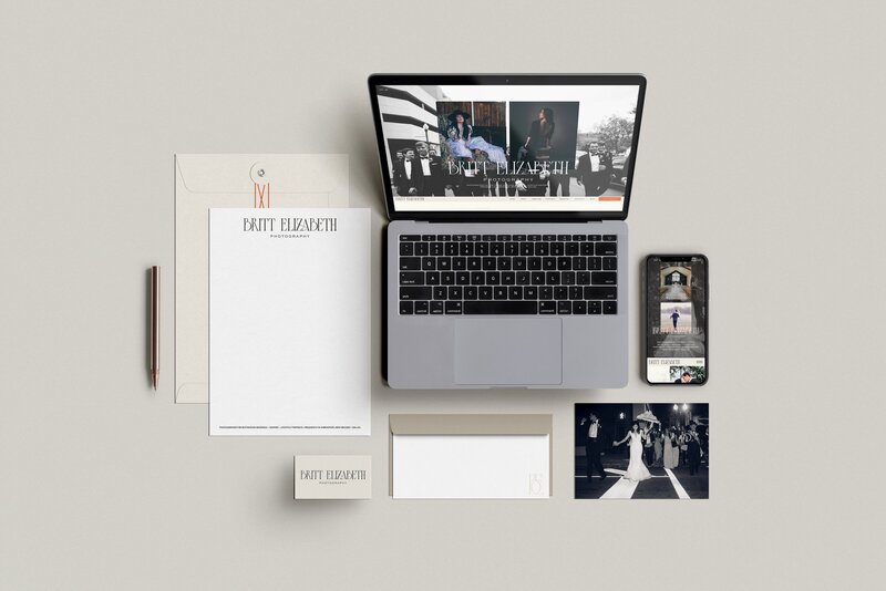 A laptop, smartphone, letterhead, business card, envelope, pencil, and two wedding photos are neatly arranged on a neutral surface—perfect for showcasing wedding photographer SEO services.