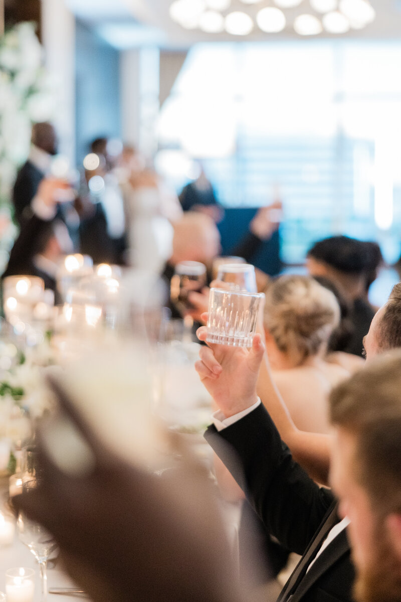 A wedding toast in ambient lighting at the Ben in West Palm Beach