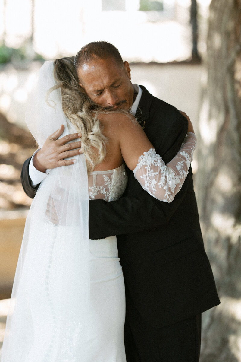 bride and father of the bride emotional first look
