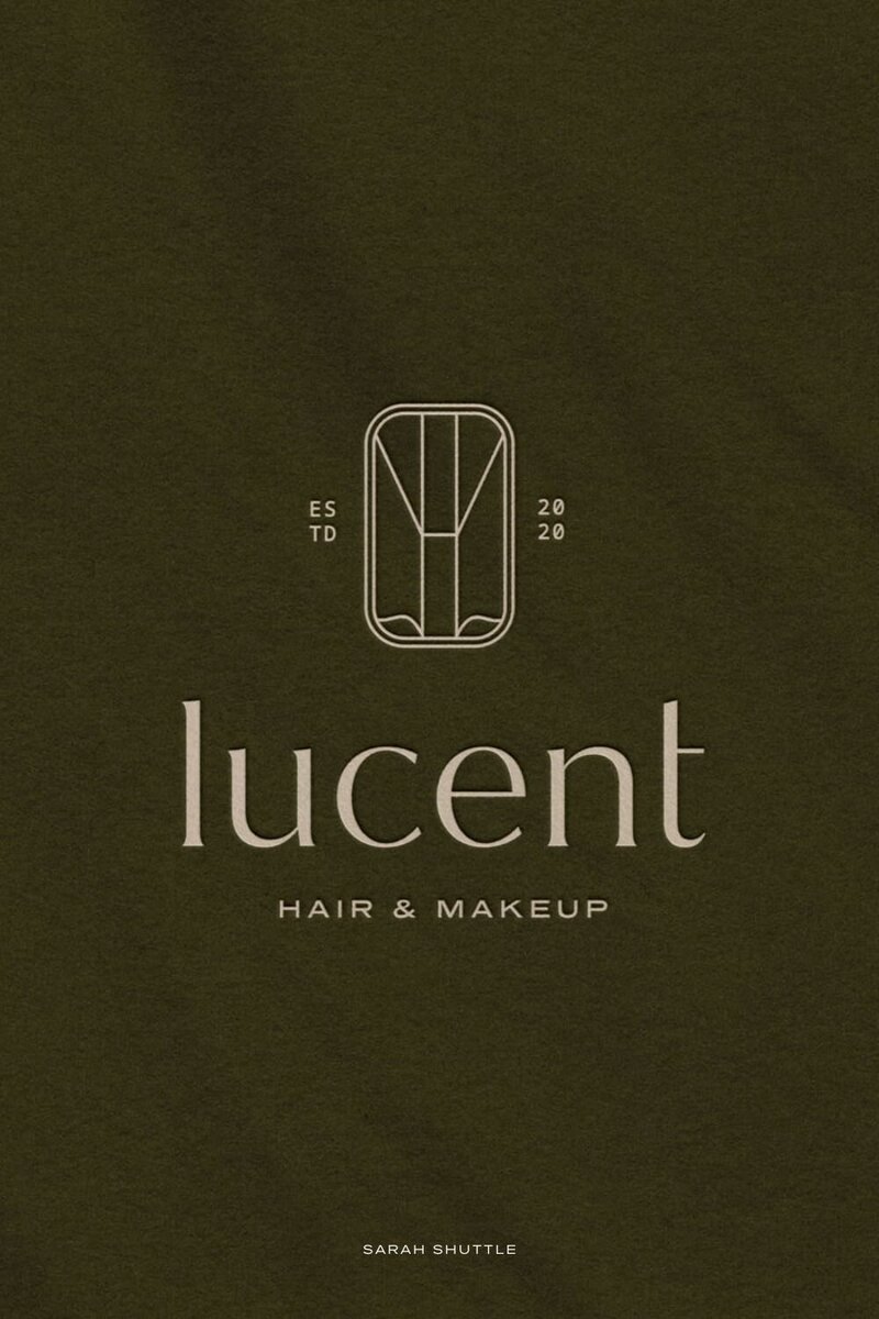 Debossed Lucent logo on a rich green textured background, showcasing the refined modern beauty brand identity.