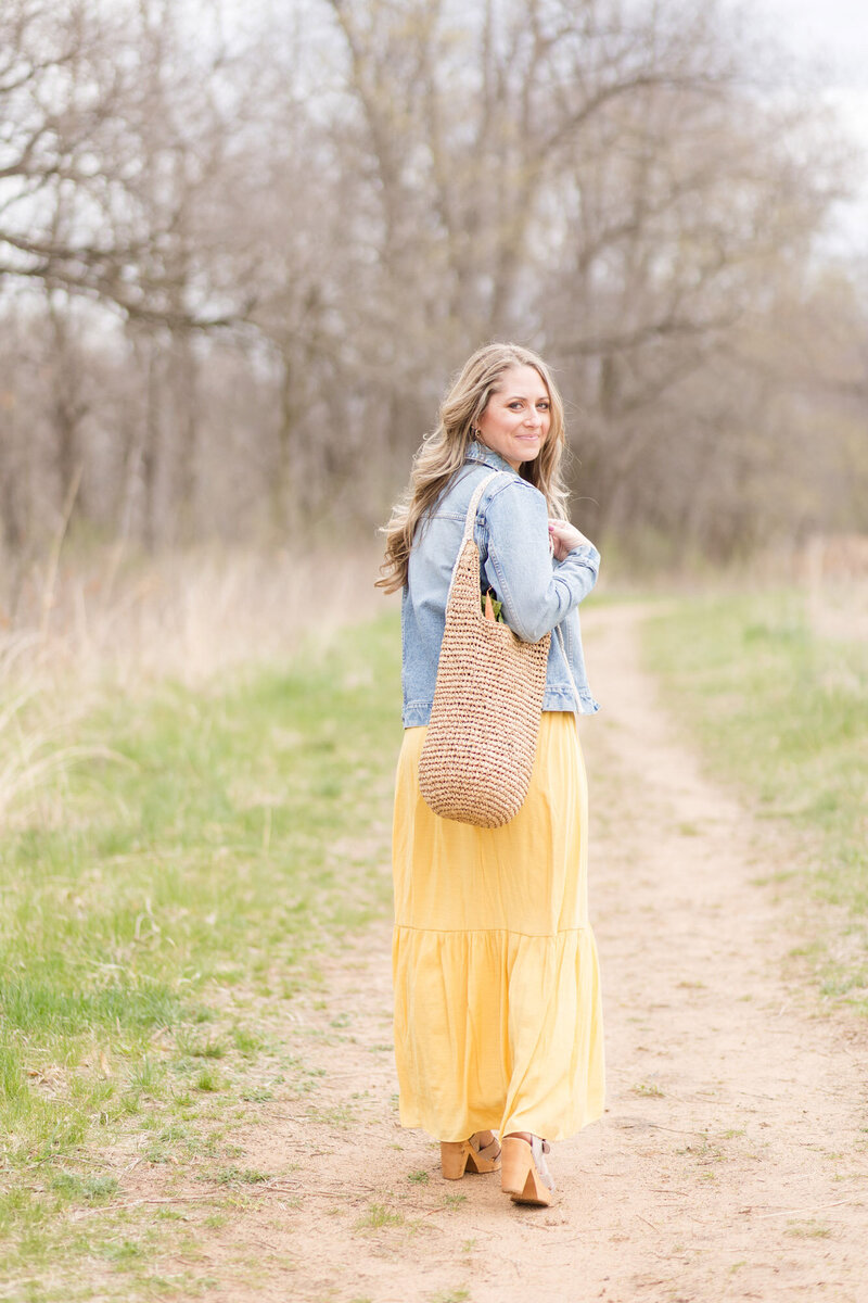 Amy walking on a dirt path