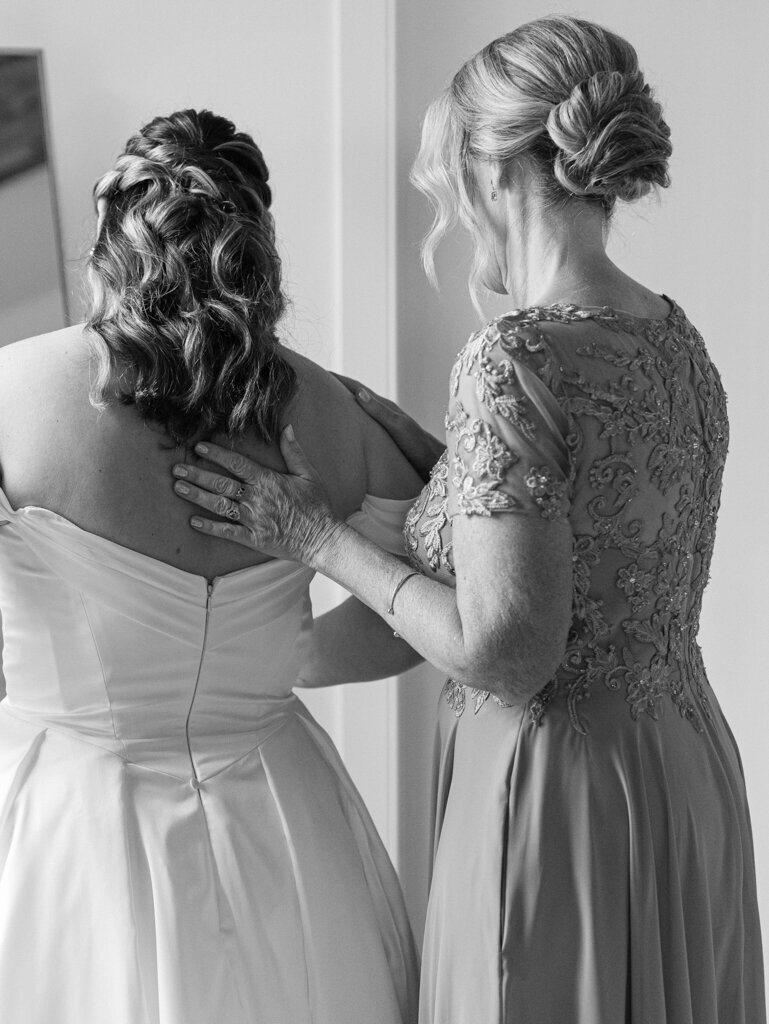 Bride and mom sharing a moment getting ready by baltimore wedding photographer, Nicole Simensky