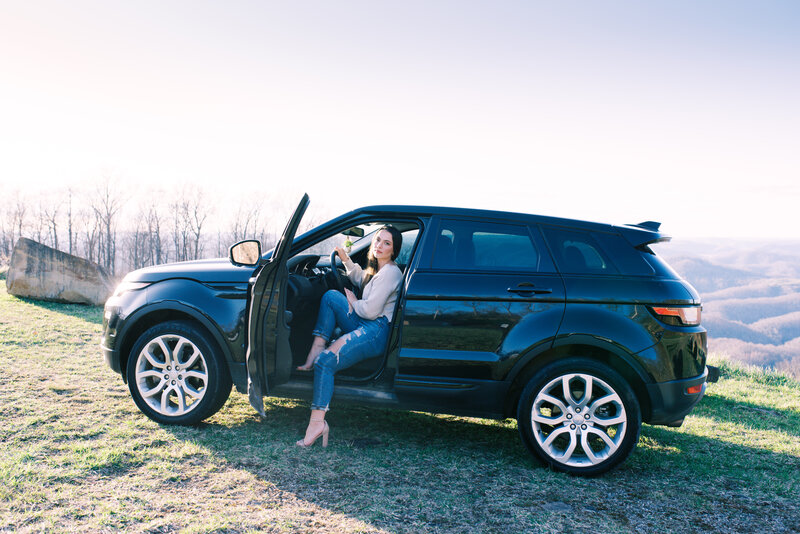 Girl getting out of her suv