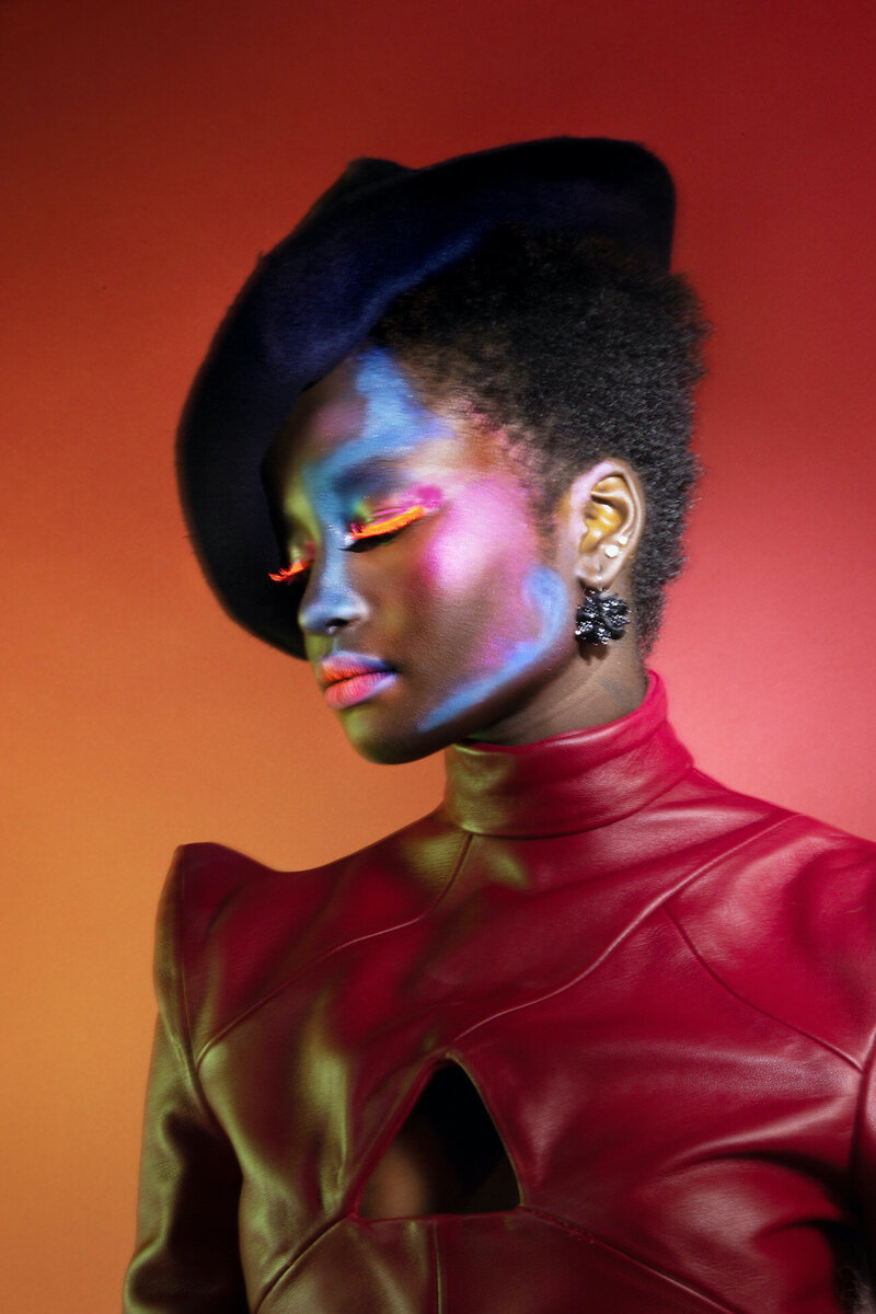 1- black-woman-red-leather-shirt-black-beret-editorial-bright-makeup