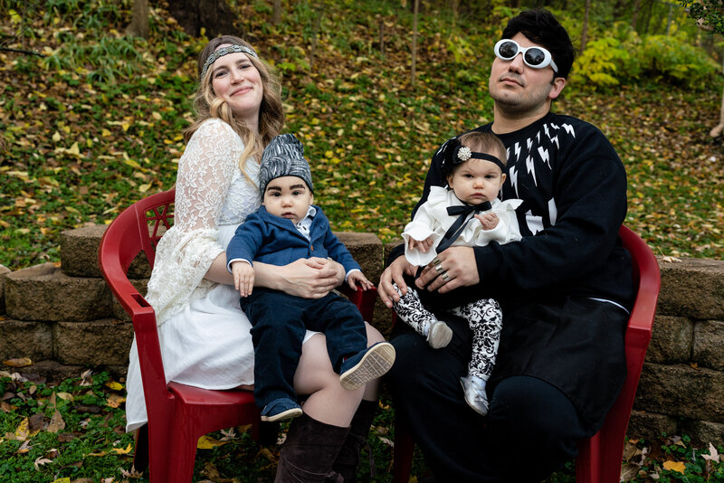 Mom and dad dressed with Schitt's Creek with twin babies.