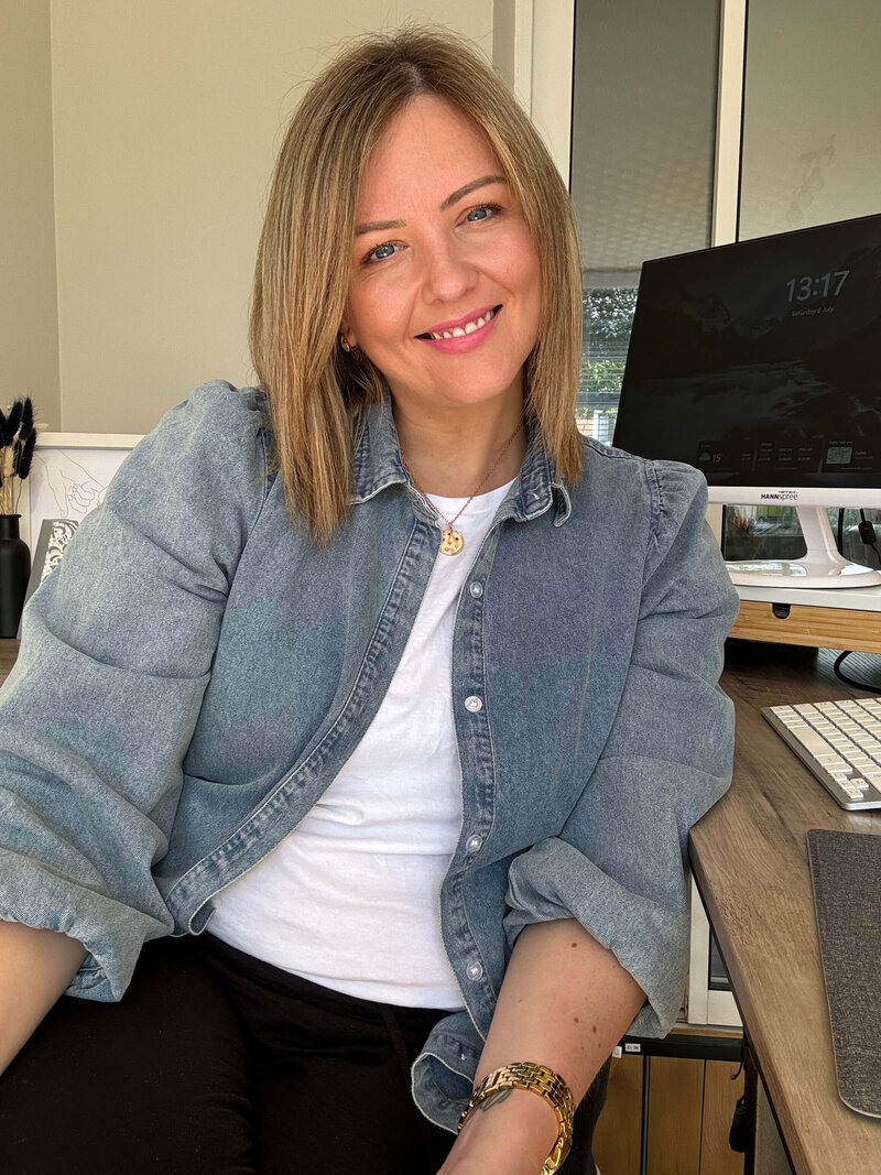 Amy, founder of Remote Results and social media manager for coaches, creatives, and wellness pros, smiling at the camera.