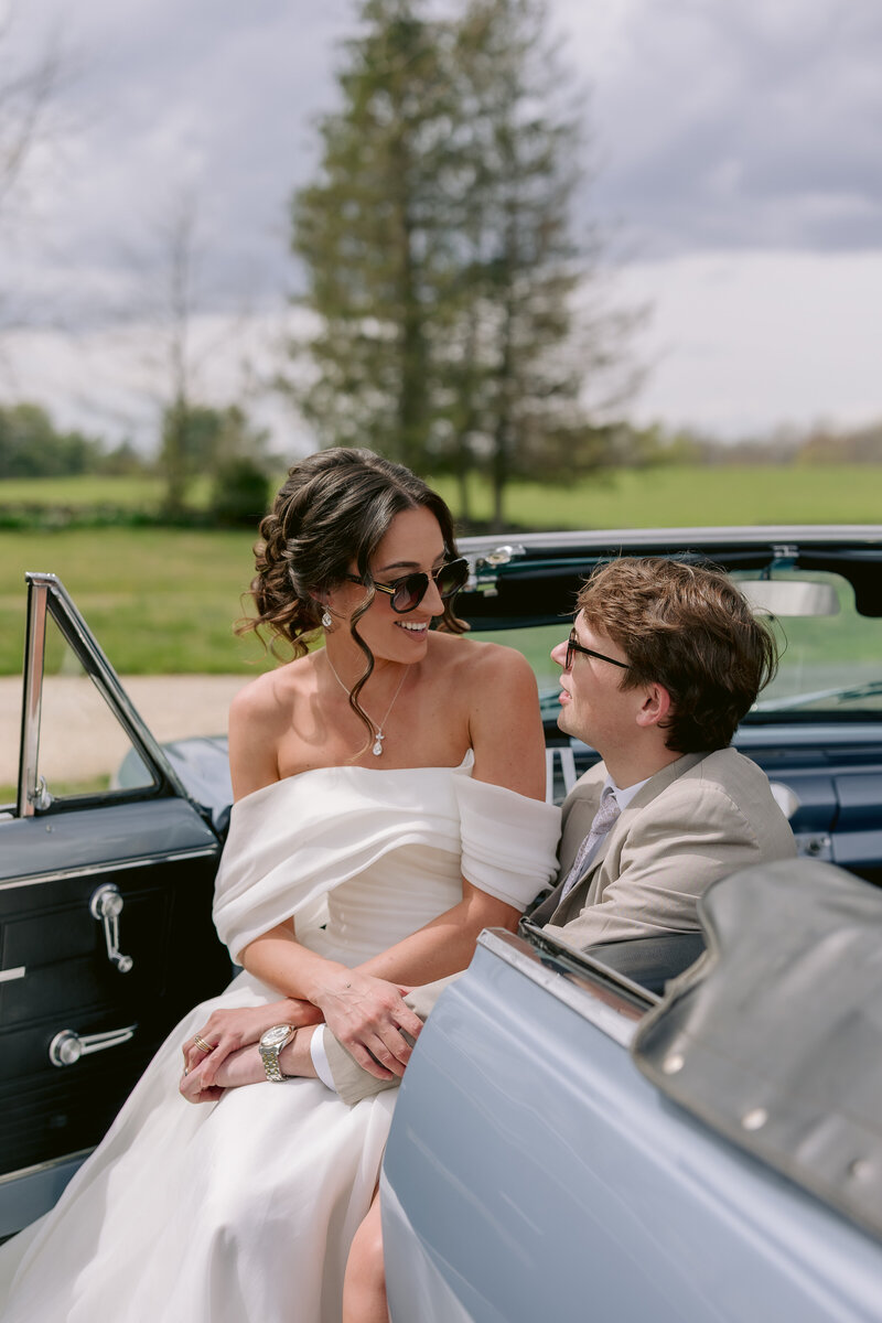 DC Wedding Photographer, a couple sitting together in an antique car