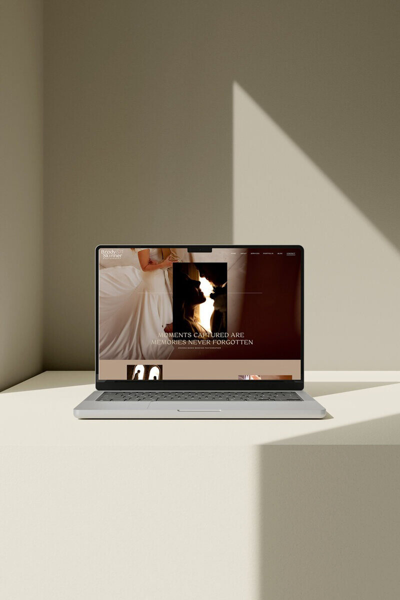 Laptop on table showing website created in showit template customization by Palme Design Co