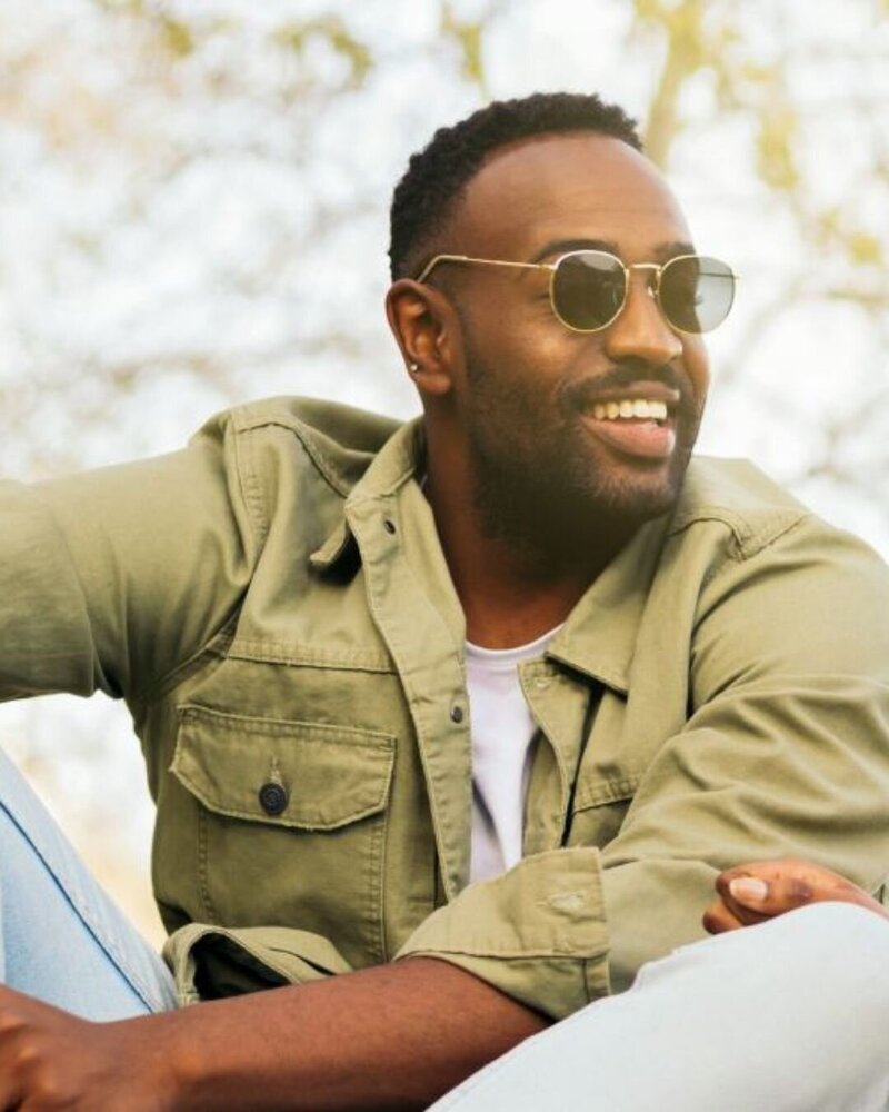 Happy, confident man smiling warmly at the camera.
