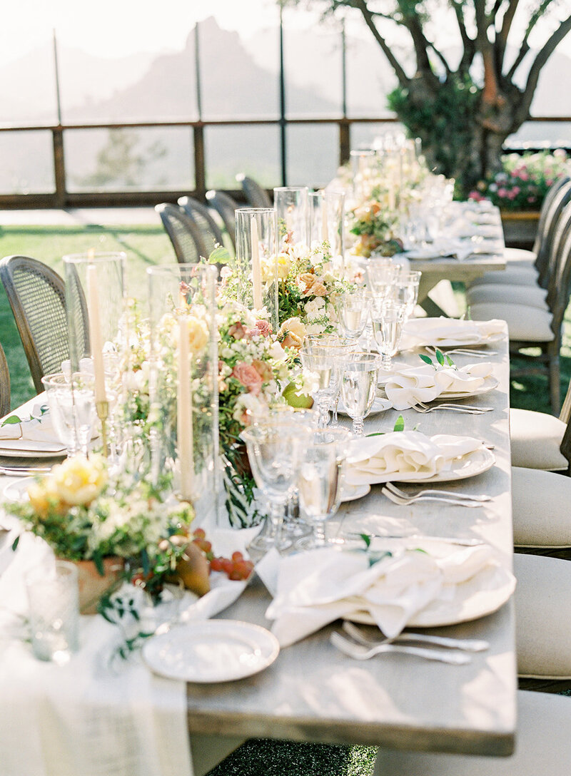 Romantic Tuscan Table Design at Cielo Farms with blush and mauve and yellow romantic florals, fruit and candles.